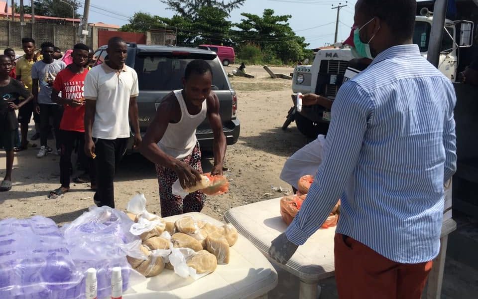 Ministry volunteers distributing food and relief supplies at a community outreach