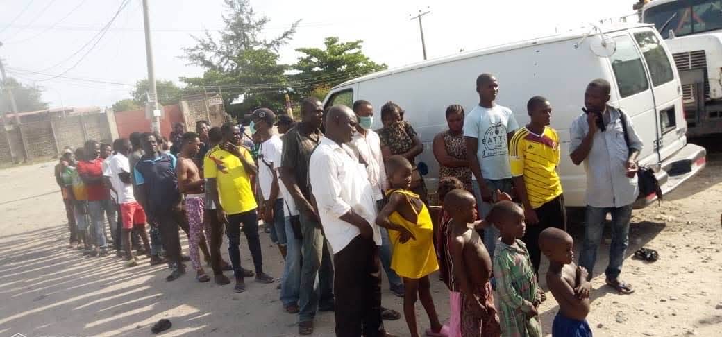 People waiting in line to receive food at a Jesus Markets outreach