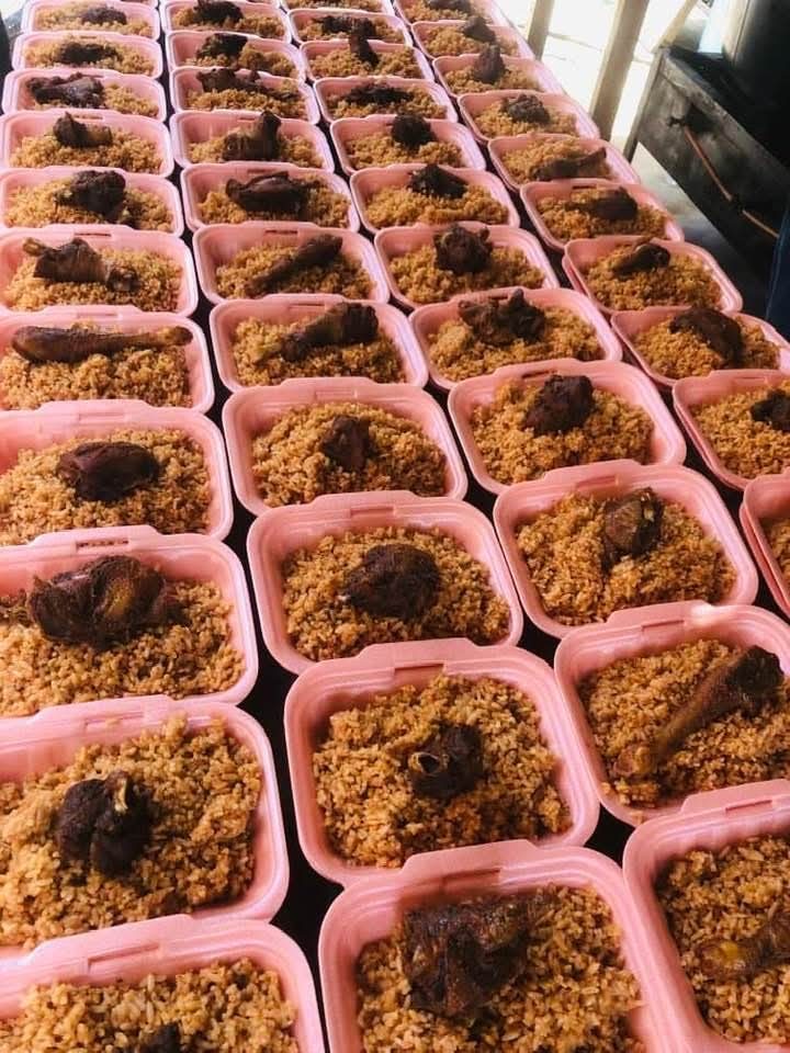 Rows of packed rice meals prepared for the food outreach