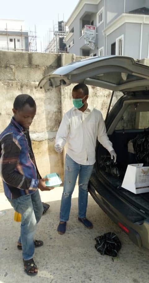 Meals being handed out from the back of a vehicle